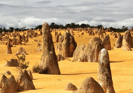 3a-Pinnacles-Desert-crop---Tobias-Keller-400 Thousands of limestone spires rise from the stark yellow landscape of the Pinnacles Desert near the western coastal town of Cervantes, Australia. (Photo by Tobias Keller)